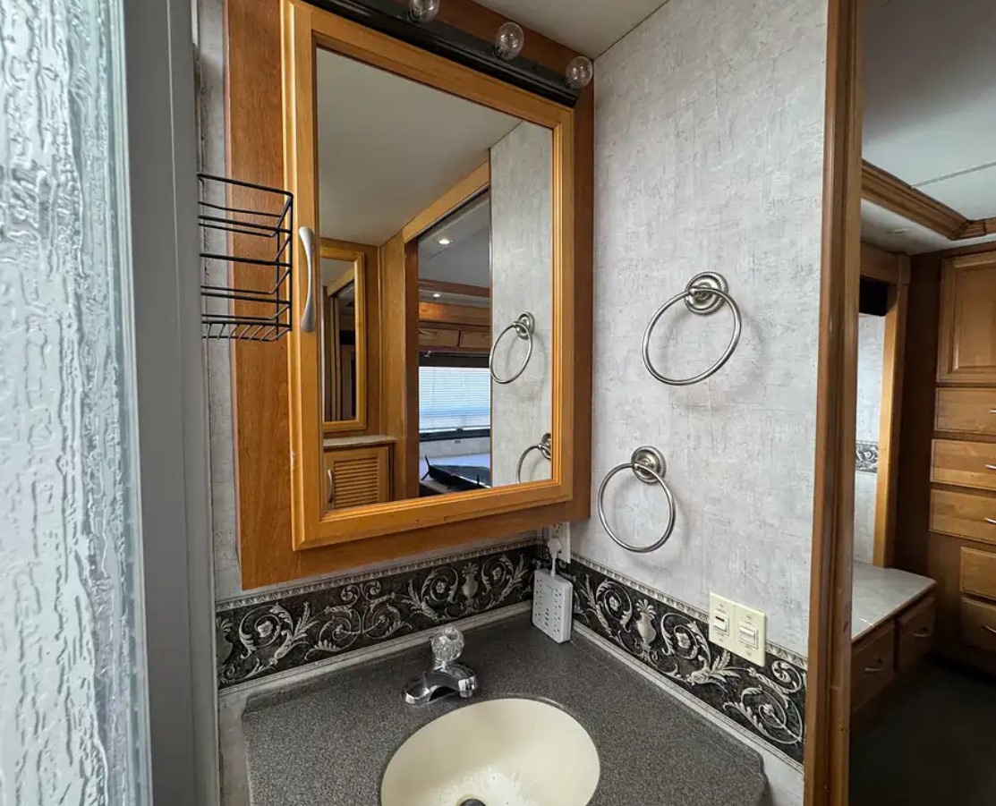 2005 Fleetwood Discovery 39L — bathroom with medicine cabinet and toilet