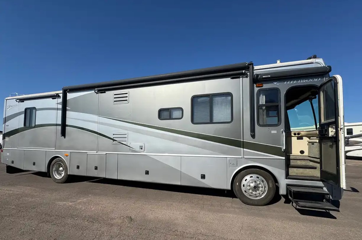 2005 Fleetwood Discovery 39L — passenger side profile with entry door open