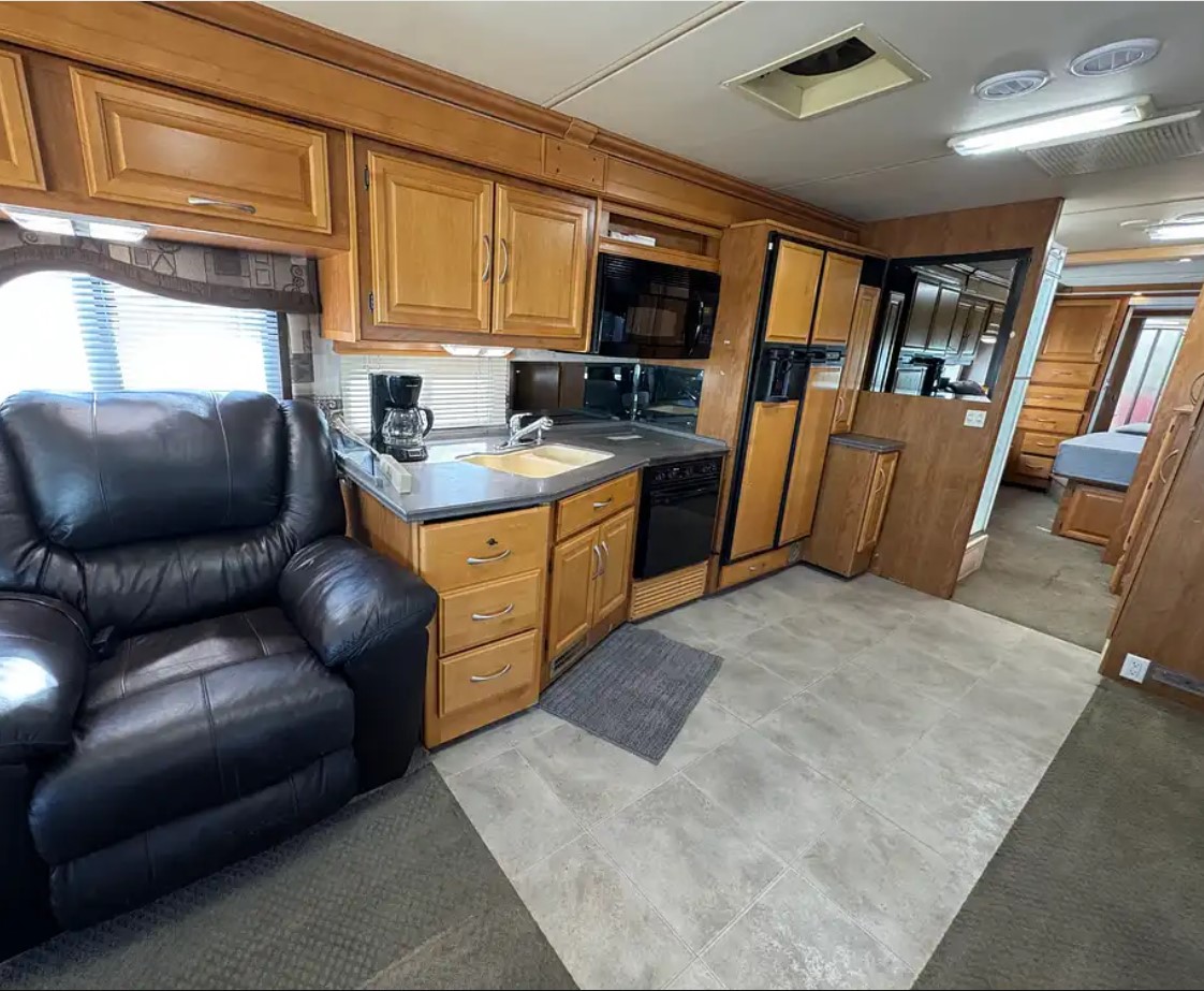 2005 Fleetwood Discovery 39L — galley and dinette looking toward the living area