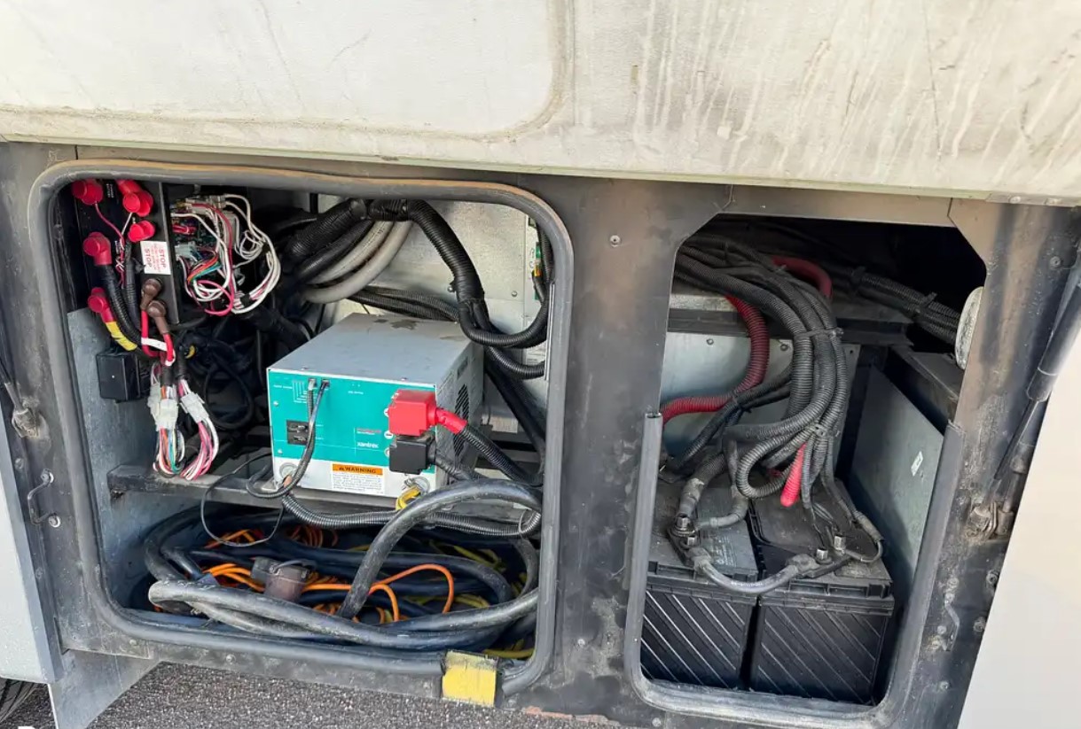 2005 Fleetwood Discovery 39L — electrical bay with inverter and wiring