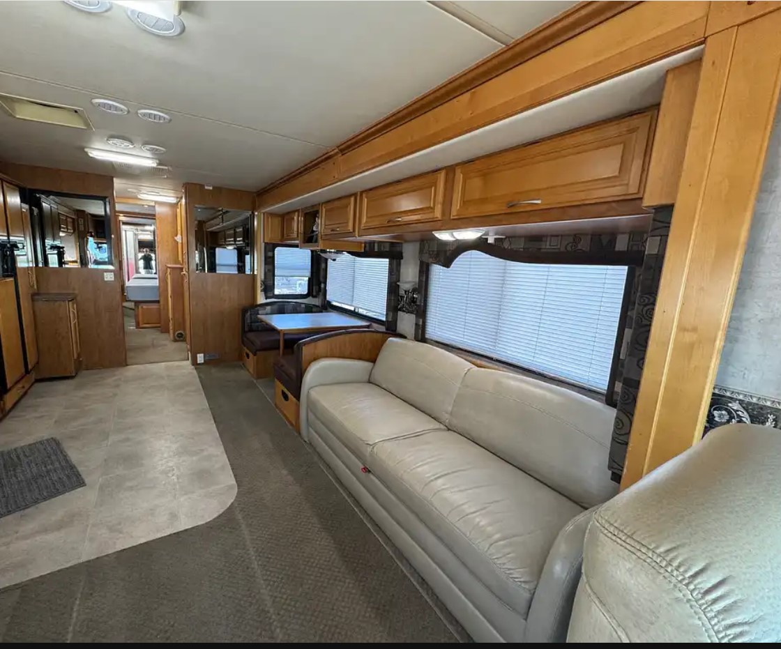 2005 Fleetwood Discovery 39L — living room slide with sofa sleeper and day/night shades